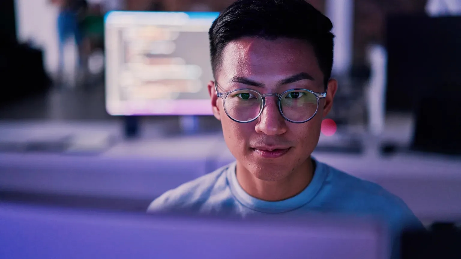 Image depicting a developer at work using AI tools to generate code.