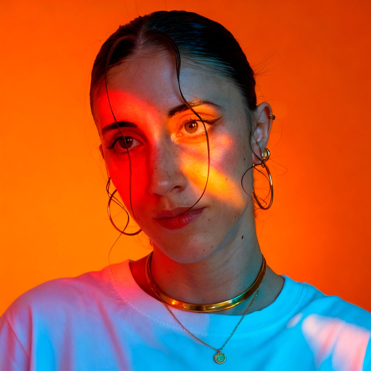 Seedream 4.5 example: studio portrait with orange and cool blue split lighting on the face