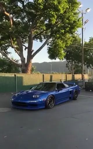Magic Hour AI Video Editor example poster labeled Change Color to Blue, showing the sports car with blue bodywork.